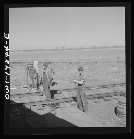 Untitled photo, possibly related to: Carrollton (vicinity), Missouri. A section gang at work along the Atchison, Topeka…