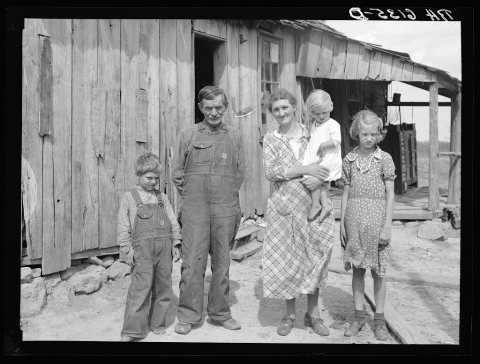 Untitled photo, possibly related to: Part of John Cain family who live in this three-room house near Ashland, Missouri.…