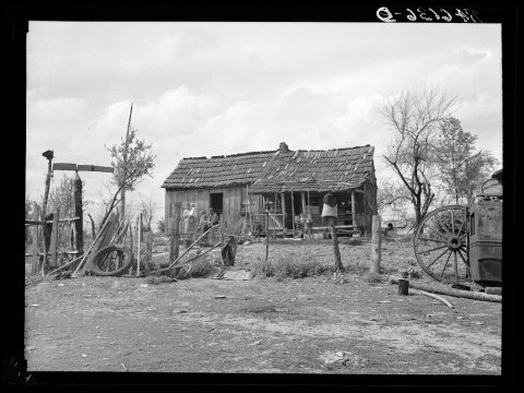 Part of John Cain family who live in this three-room house near Ashland, Missouri. University of Missouri game and arbo…