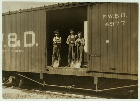 Three Boys Shoveling Zinc Ore from Car Into Wagon, Near Big Bonanza Mine