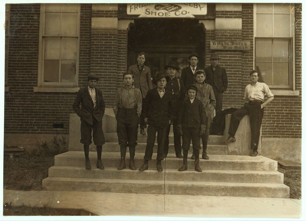 Group of boys working in Freidjman [i.e., Friedman] Shelby Shoe Company, 6:30 A.M. (See photo #1718 for names of boys.)…