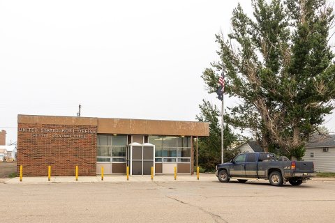 Chester MT USA June 13 2025 - USPS Post Office on a foggy day