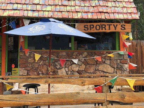 Blue porch umbrella at Sportsman's Bar in Alberton, Montana 2017