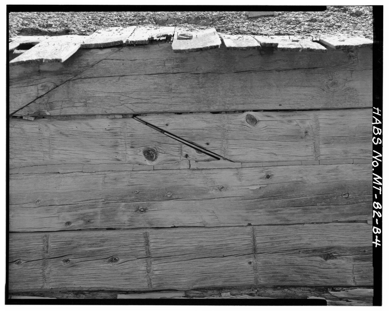 'SCARFING' (ANGLED JOINTS, CENTER AND TOP LEFT) OF LOGS ON FRONT OF HOUSE - Doc Taylor Place, House, East Fork of Armel…