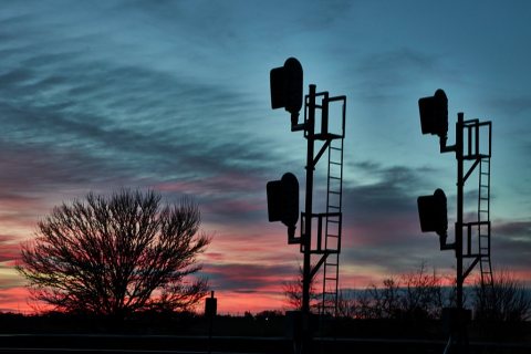 Sunset view of railroad signals along the Grand Island railroad line