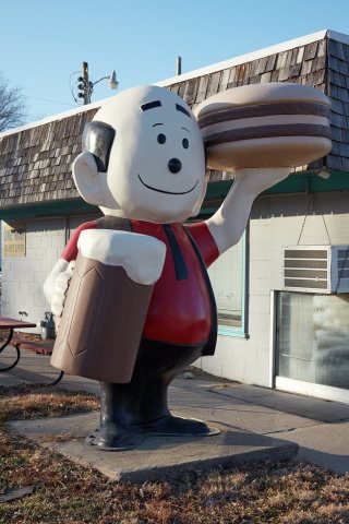 This balding, upbeat-looking fellow is the street side attraction for the Dairy Sweet store