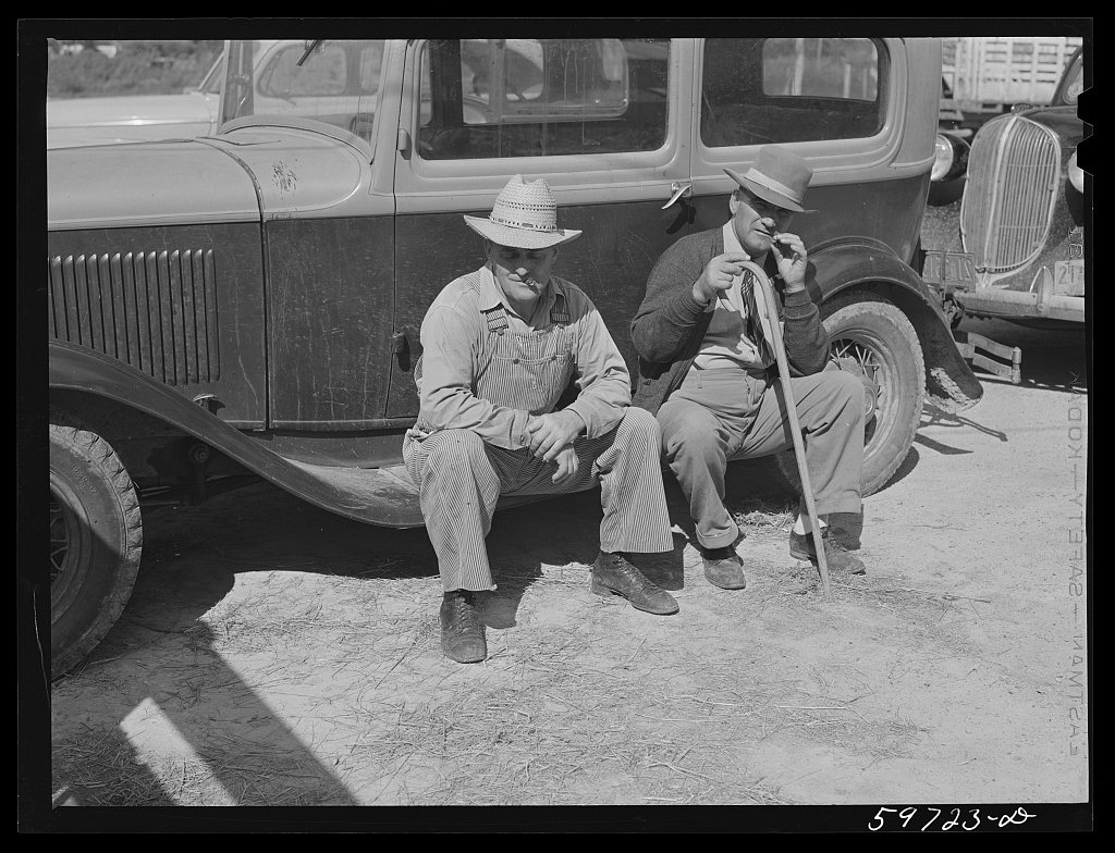 Untitled photo, possibly related to: Men outside the Union Livestock Commission Company during an auction sale. Gering,…