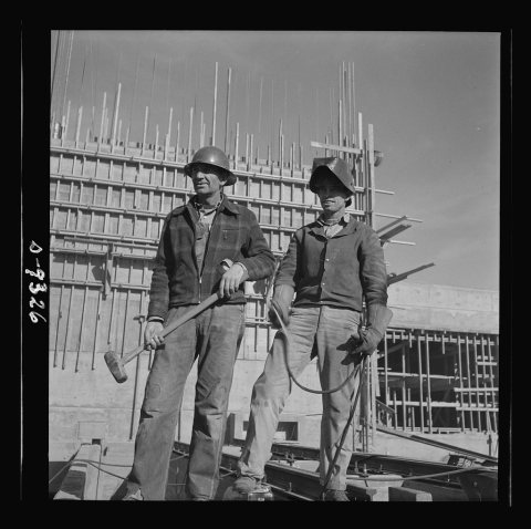 Production. Magnesium. A rigger and a welder at the new Basic Magnesium plant in the southern Nevada desert look out ac…