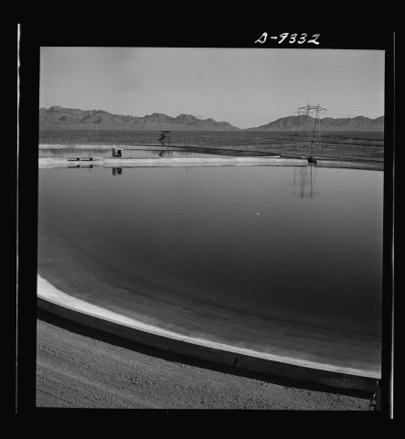 Production. Magnesium. Two enormous reservoirs at the huge Basic Magnesium plant in the southern Nevada desert, holding…