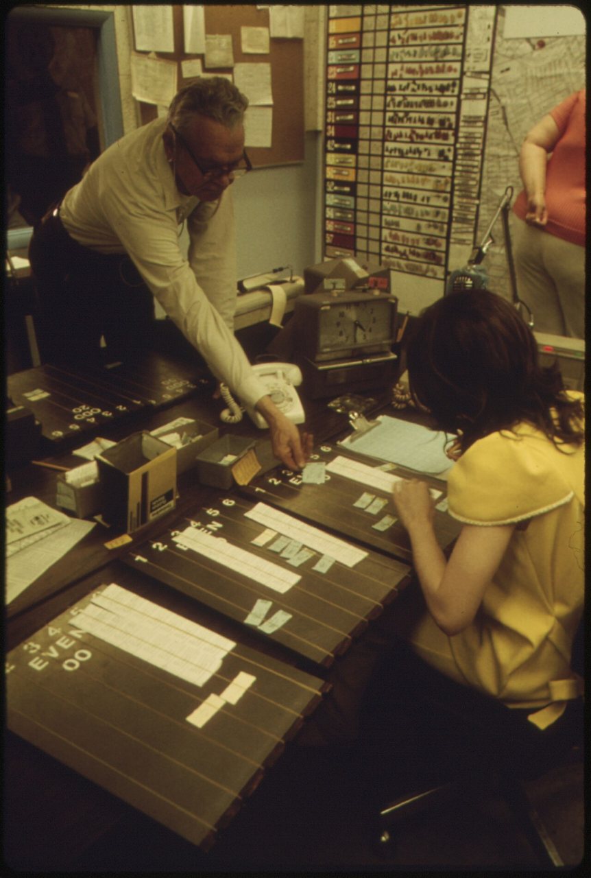 DISPATCHING CENTER FOR DIAL A RIDE RADIO DISPATCHED DOOR-TO-DOOR BUS SYSTEM IN