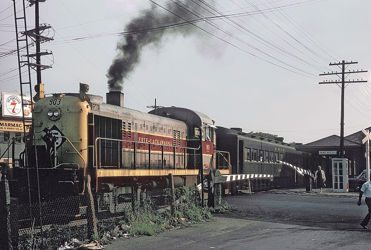 Erie-Lacawanna 903 with NJ+NY Train 446 leaving Hackensack, NJ station on September 3, 1965