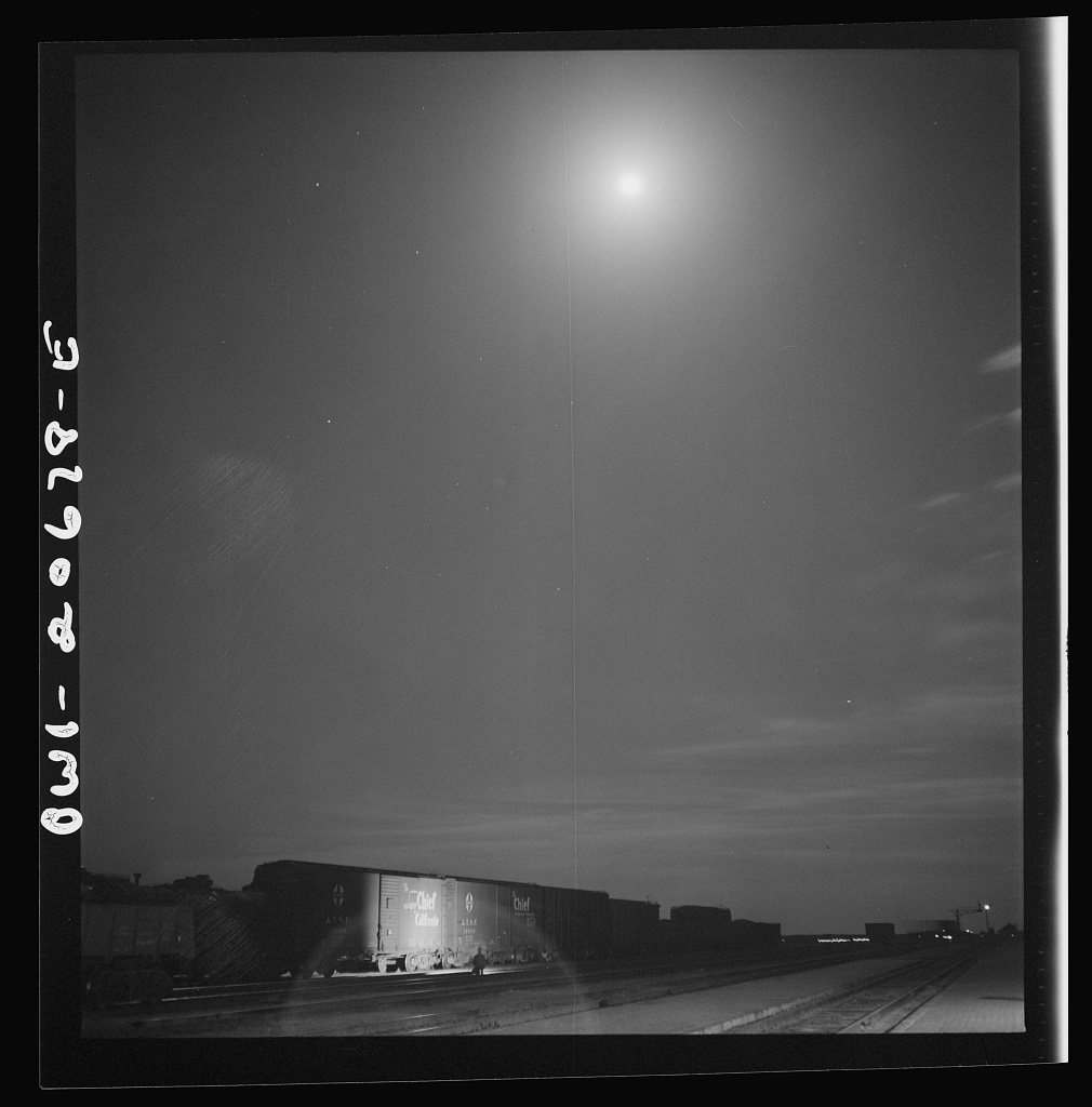Untitled photo, possibly related to: Vaughn, New Mexico. Train inspector at work in the Atchison, Topeka and Santa Fe R…