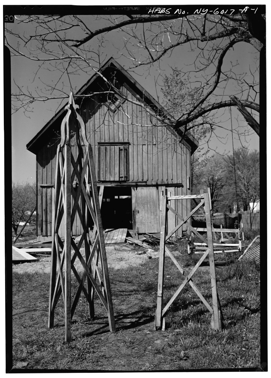 VIEW OF ROSE TRELLIS WITH BARN BEYOND - Timothy Copp Rose Trellis and Barn