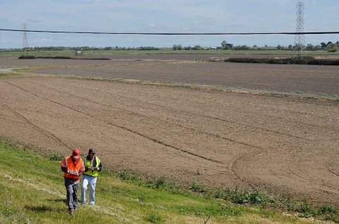 Inspecting a Sacramento River levee