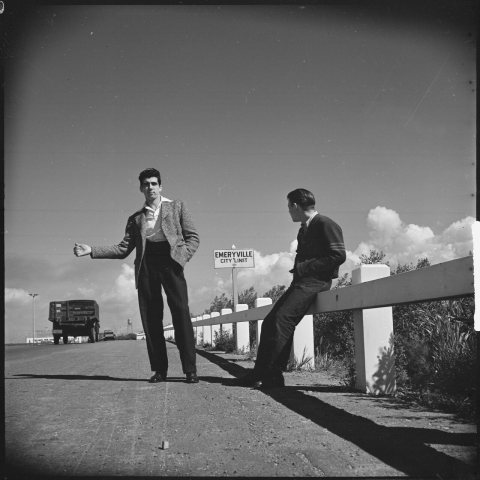 Oakland, California. Hitch-hiking. A professional job of "thumbing." These two boys travel together from one... - NARA …