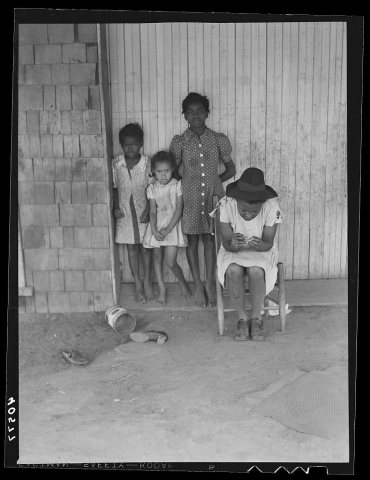 Some of the people living in an old garage converted into a dwelling. Outskirts of Graham, Alamance County, North Carol…