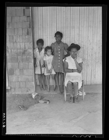 Some of the people living in an old garage converted into a dwelling. Outskirts of Graham, Alamance County, North Carol…