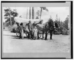 Bargain day, a covered wagon traveling salesman weighing produce