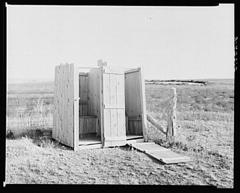 Duplex privy (open air model) near Arnegard. McKenzie County, North Dakota