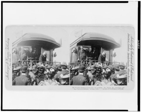 The President shaking hands from rear platform; Sec. Wilson, Sec. Hitchcock and Sec. Cortelyou with him--Alliance, Ohio