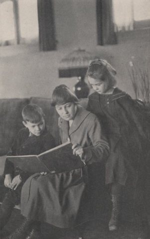 First School Teacher Reading to Students in