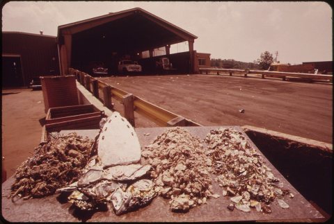 SORTING TABLE OUTSIDE RECYCLING PLANT IN