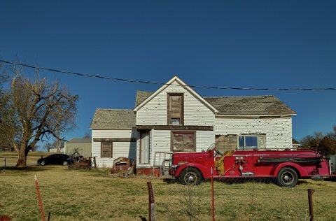 A fire truck is parked, inexplicably, outside this home in the tiny Oklahoma community of Foss, along old U.S. Highway …