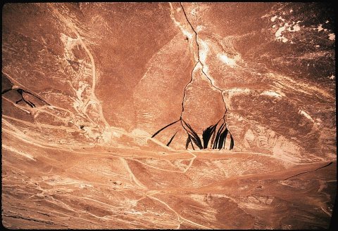 OIL WASTE ON BARREN HILLSIDE