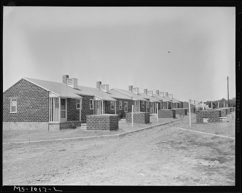 Houses in government housing project originally intended for coal miners. Oil field workers occupy a few of these... - …