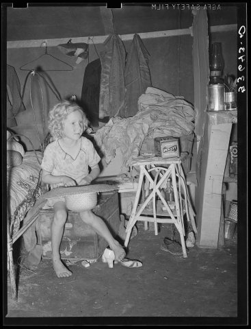 Child of agricultural day laborer in tent home near Spiro, Oklahoma. Sequoyah County