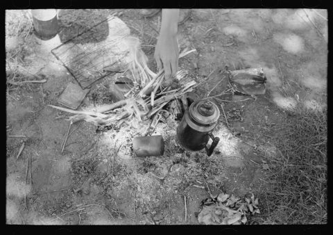 Building a fire, migrant camp near Prague, Oklahoma