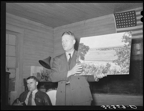 District soil conservation supervisor illustrating soil conservation methods by use of enlarged photographs. Meeting of…