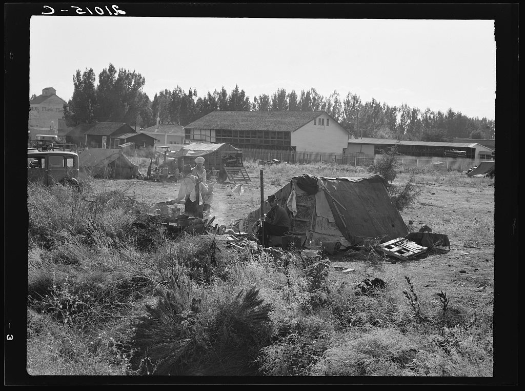 Untitled photo, possibly related to: One of the forty potato camps in open field, entering town. Malin, Klamath County,…