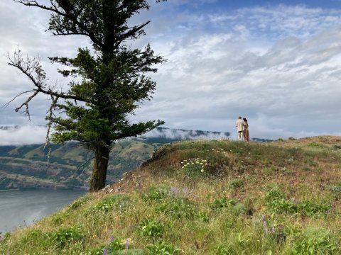 Couple on hill overlooking Columbia River Gorge 01