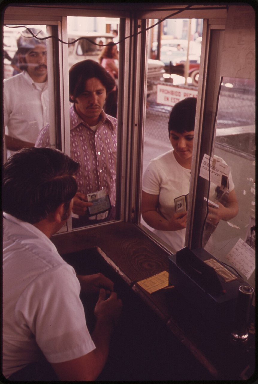 MEXICAN GREEN CARD FARMWORKER, JUGO OLIVAS, AND HIS WIFE CROSS BORDER AT CALEXICO TO SHOP IN AMERICAN STORES. HIS... - …