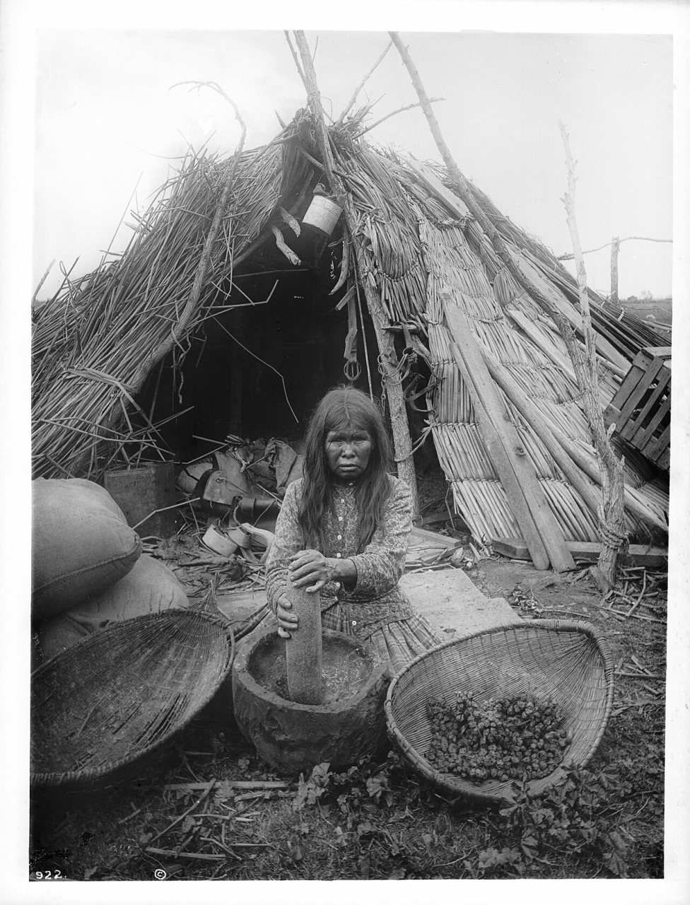 Paiute indian woman grinding acorns for flour, Lemoore, Kings County, ca.1900 (CHS-922)