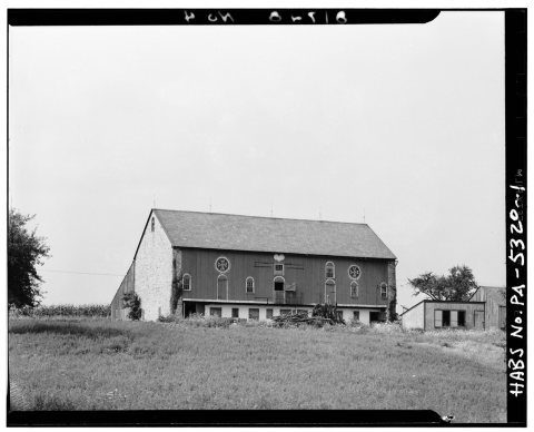 GENERAL VIEW. NOTE A PAINTED HEART IN THE CENTER OF THE OVERHANG. ALSO NOTE HEX SIGNS AND PAINTED DOOR AND WINDOW 'HEAD…