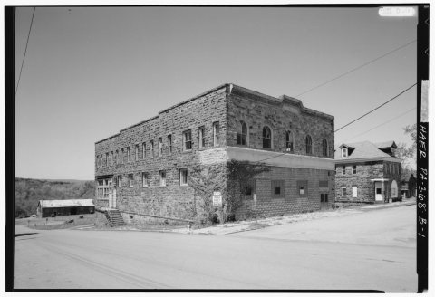 SOUTH AND EAST (MAIN) FACADE OF COMPANY STORE, LOOKING NORTHWEST; THE STONE BUILDING TO THE RIGHT IS THE BANK - Merchan…