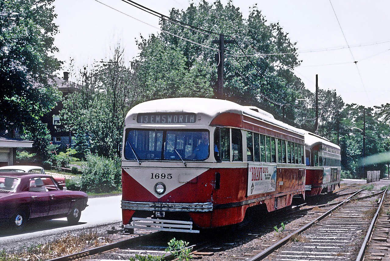 PAAC PCC 1695, a "cripple" on -13 ELMSWORTH line being pushed by PCC 1796, a -15 BELVUE car, Pittsburgh, PA on June 26,…