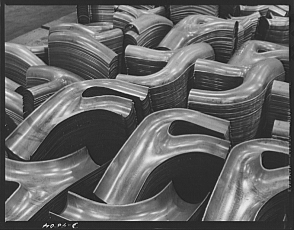 Production. BT-13A ("Valiant") basic trainers. Exhaust stacks for "Valiant" basic trainers at Vultee's Downey, Californ…