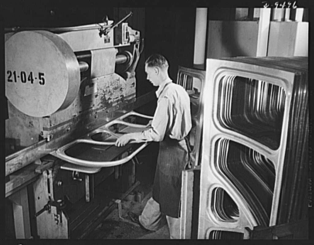 Production. BT-13A ("Valiant") basic trainers. Pressing parts for "Valiant" basic trainers at Vultee's Downey, Californ…