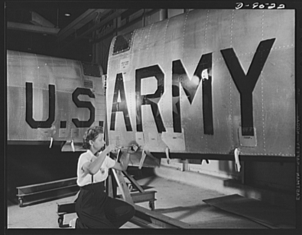Production. BT-13A ("Valiant") basic trainers. Final inspection of a wing for a "Valiant" basic trainer at Vultee's Dow…