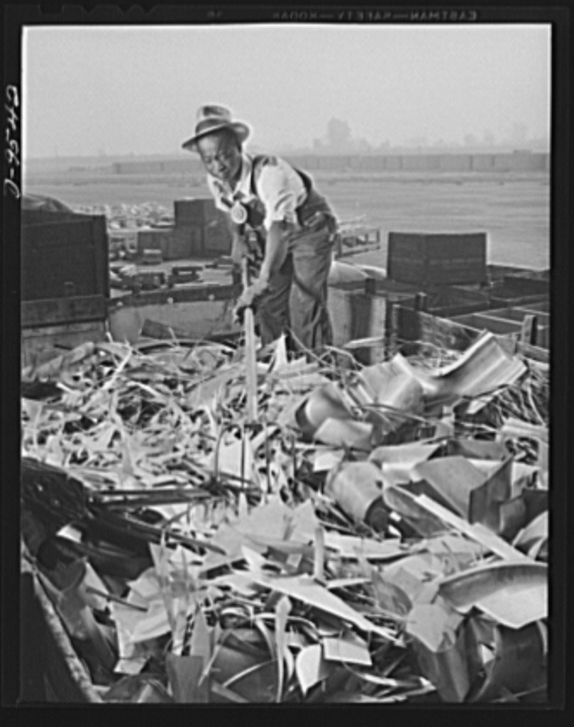Production. BT-13A ("Valiant") basic trainers. Scrap pile being sorted at Vultee's Downey, California plant. At the Dow…