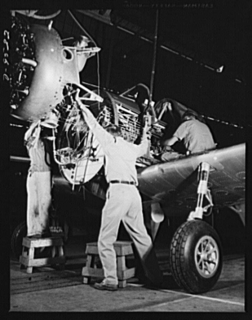 Production. BT-13A ("Valiant") basic trainers. Final inspection of a wing for a "Valiant" basic trainer at Vultee's Dow…