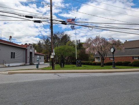 Dalton, PA veterans memorial and street clock, April 2025