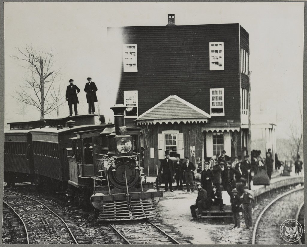 Hanover Junction Pennsylvania, 1863, railroad station. Detail of engine in yard and waiting crowd