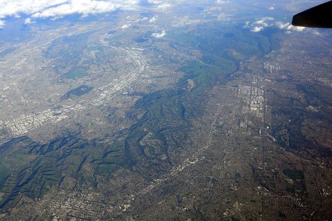Aerial view looking just north of east toward City of Industry, South San Jose Hills, and Fullerton, CA