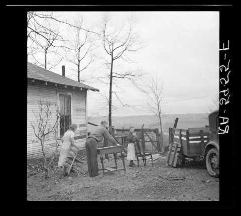 The Eargle Family moving their household goods out of their home at Fairfield, Alabama. They will become homesteaders a…