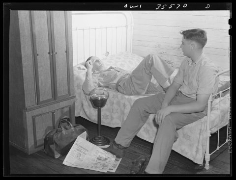 Bowman, South Carolina. Sergeant John Riley, of the 25th service group, Air Service command, home on leave talking thin…