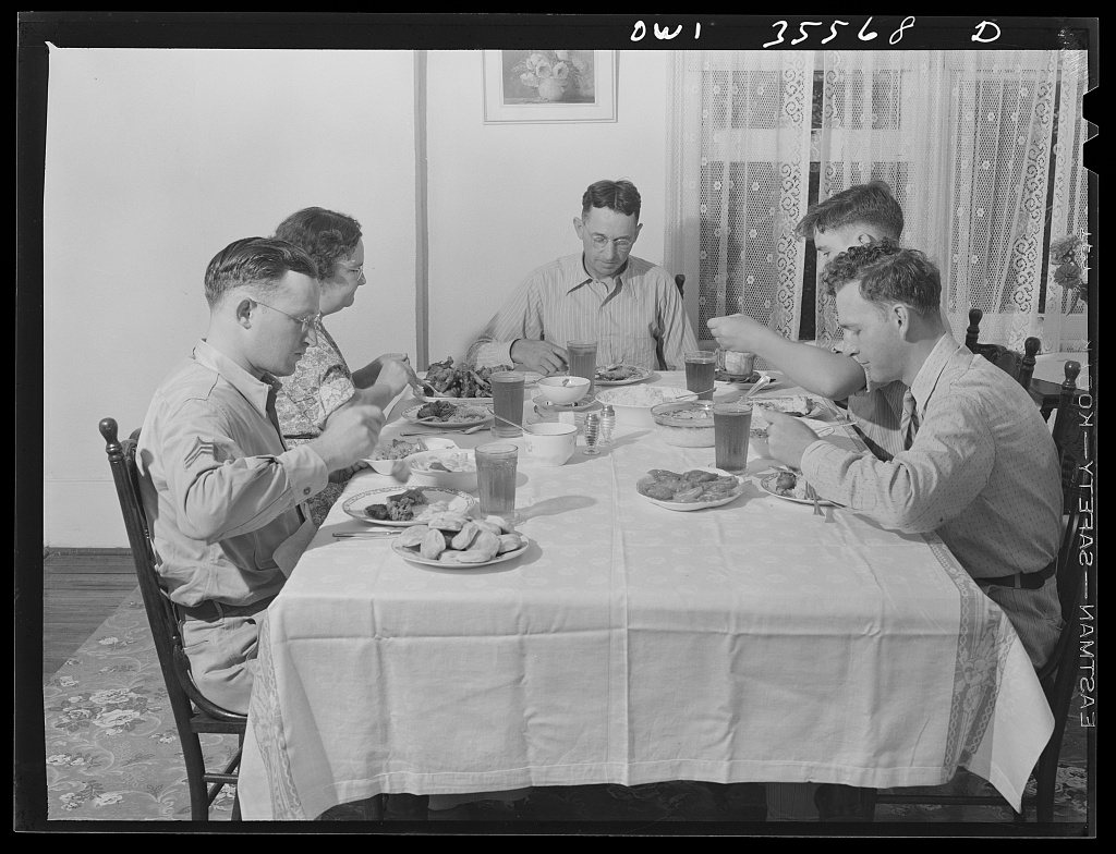 Bowman, South Carolina. Sergeant John Riley, of the 25th service group, Air Service Command, home on leave having dinne…
